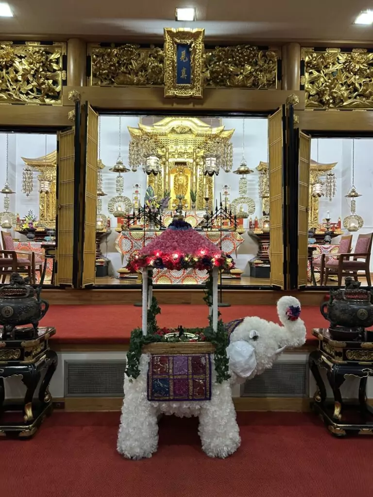 Image of Shin Buddhist altar for Hanamatsuri service celebrating the birth of Sakyamuni Buddha, featuring a white elephant